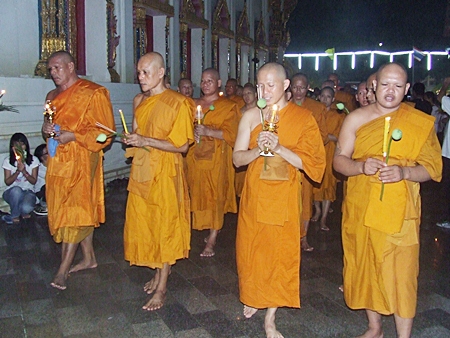 Monks lead the Wien Thien ceremony around Wat Chaimongkol last Tuesday for Visakha Bucha Day. Visakha Bucha Day is one of the three holiest days on the Buddhist calendar and this year was designated by UNESCO as “World Peace Day.”